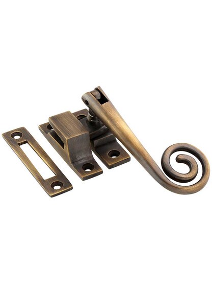 Solid-Brass Casement Latch with Curly Handle in Antique-By-Hand.