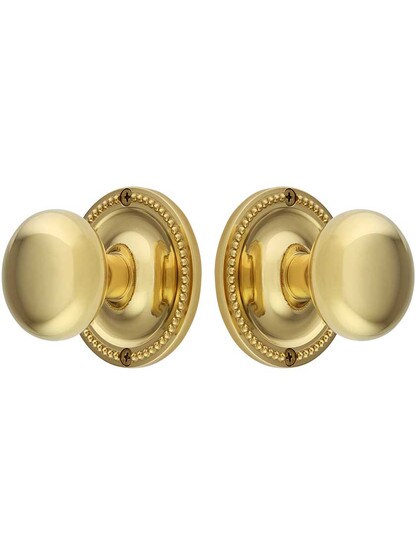 Alternate View of Large Beaded Rosette Door Set with Wrought Brass Knobs.