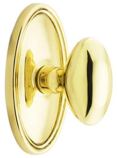 Oval Rosette Set With Elliptical Brass Knobs in PVD.