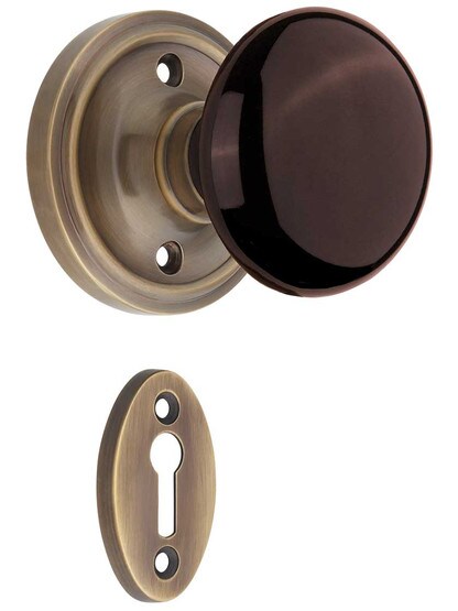Classic Rosette Mortise-Lock Set with Brown Porcelain Knobs in Antique-By-Hand.
