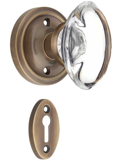Classic Rosette Mortise-Lock Set with Oval Crystal Glass Knobs in Antique-By-Hand.