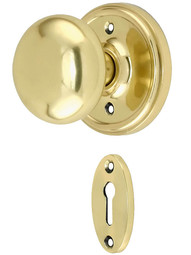 Classic Rosette Mortise Lock Set with Round Brass Knobs.