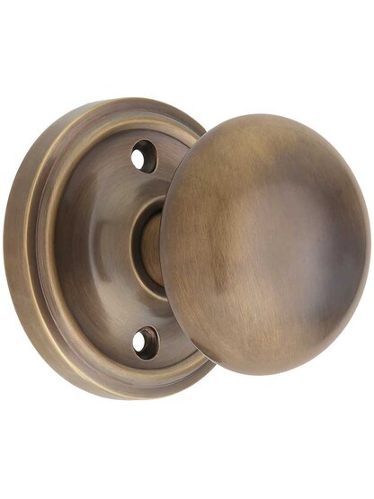 Classic Rosette Door Set with Solid Brass Knobs in Antique-By-Hand.