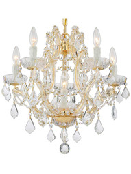 Maria Theresa Clear Crystal 6 Light Mini Chandelier in Gold.