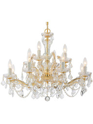 Maria Theresa Clear Crystal 12 Light Chandelier in Gold.