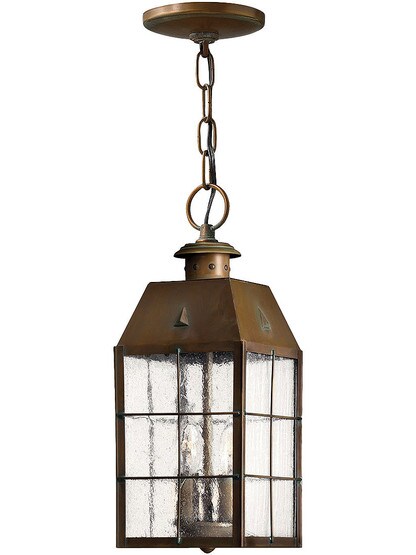 Aged Brass Nantucket Hanging Porch Light With Clear Seedy Glass.