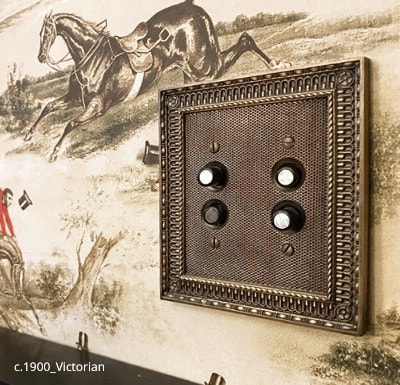 Pisano switch plate and push button switches in the powder room