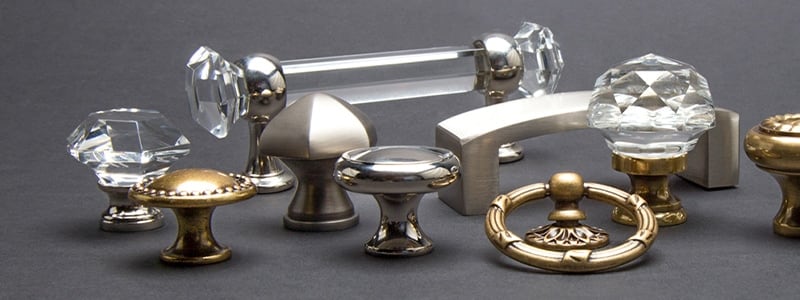 An array of glass and brass cabinet knobs in many styles