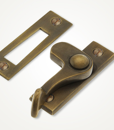 Vertical handle casement latches