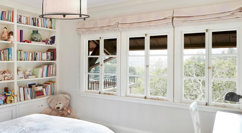 These breezy bedroom casement windows are outfitted with traditional latches, sliding stays, and miniature bolts. 