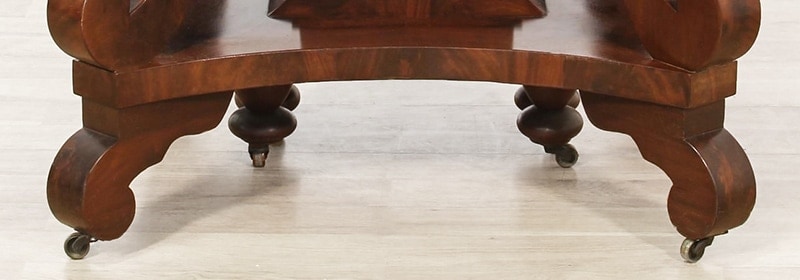 Antique table with brass casters under each foot