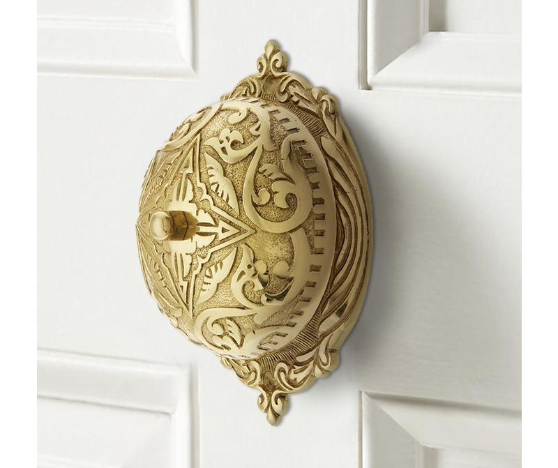 A reproduction Victorian doorbell mounted on the inside of the front door. 