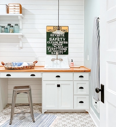 Multipurpose mudroom with desks and cubbies.