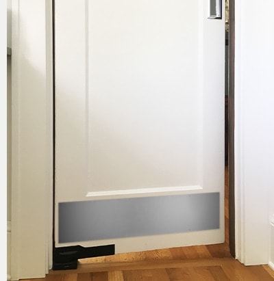 Residential dining room door with satin nickel kick plate