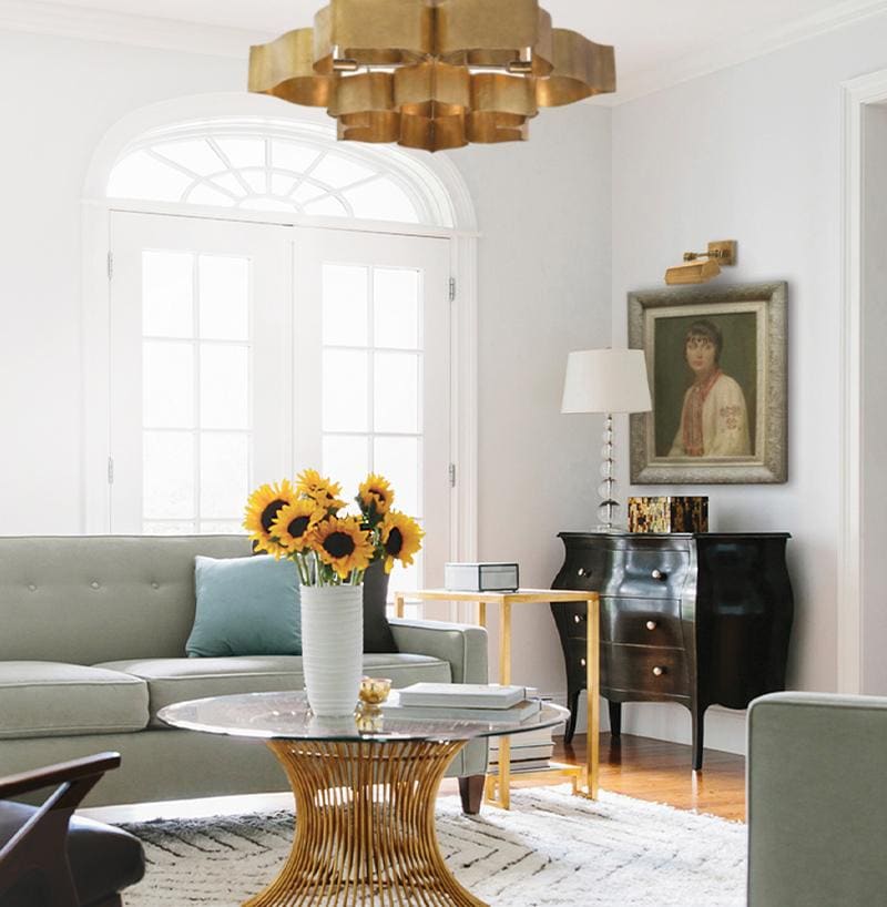 Bright and airy traditional living room with modern chandelier