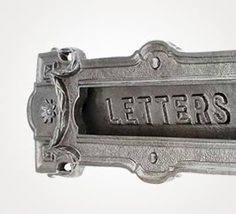 Neo-classical style mail slot in iron