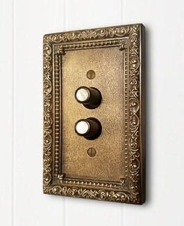 Decorative switch plates and push button switches