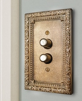 Decorative switch plates and push button switches