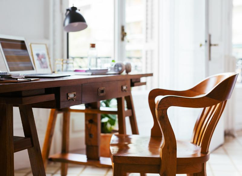 Vintage label holders with finger pulls are a practical addition to this custom wooden desk. 