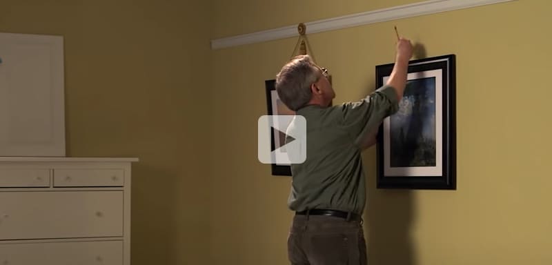 Watch our video on hanging pictures using cord and hooks