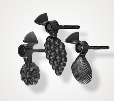 Decorative cast iron shutter tie-backs