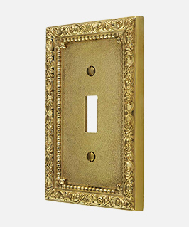 Floral Victorian switch plate in unlacquered brass